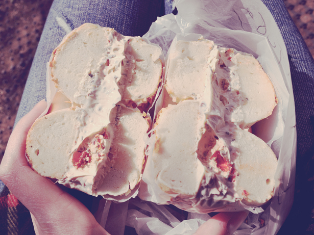 Onion bagel with creme cheese and dried tomatoes